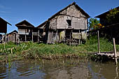 Inle Lake Myanmar. All the buildings are constructed on piles. Residents travel around by canoe, but there are also bamboo walkways and bridges over the canals, monasteries and stupas. 